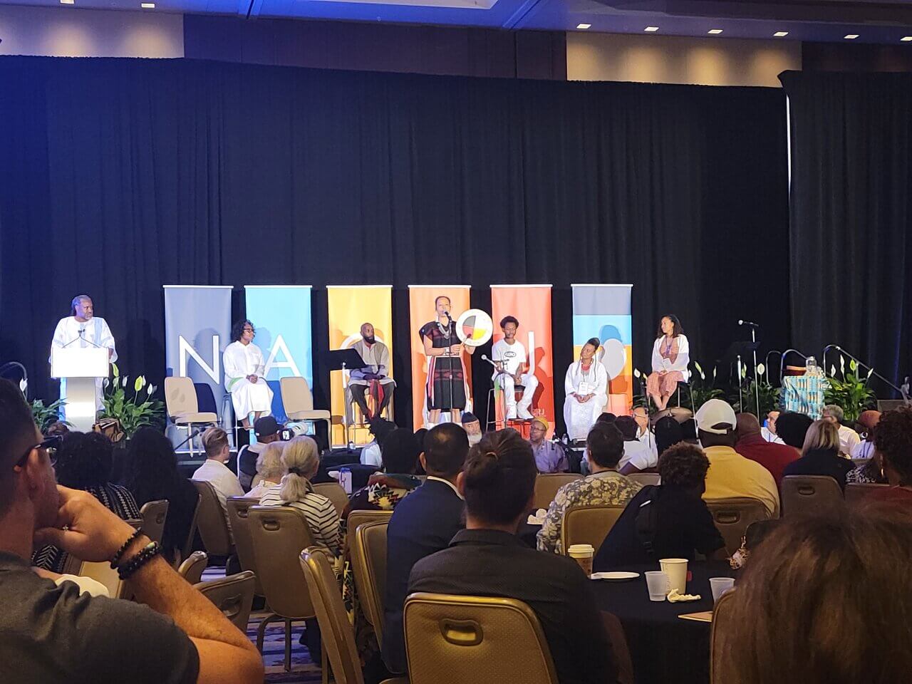 the photo shows the center of a restorative dialogue circle that is often a format used for training and discussion. Many restorative values, books, and sentimental objects of significance fill the colorful center to help ground participants during circle.